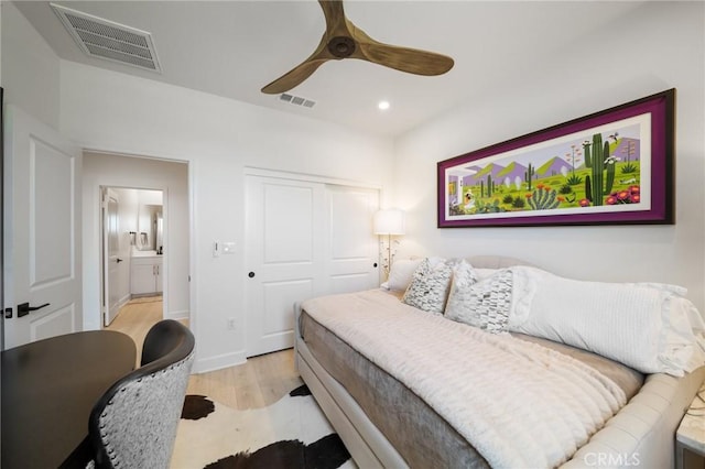 bedroom with visible vents, recessed lighting, light wood-style floors, and a closet