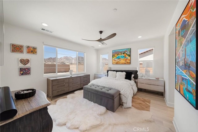 bedroom featuring ceiling fan, recessed lighting, baseboards, wood finished floors, and visible vents