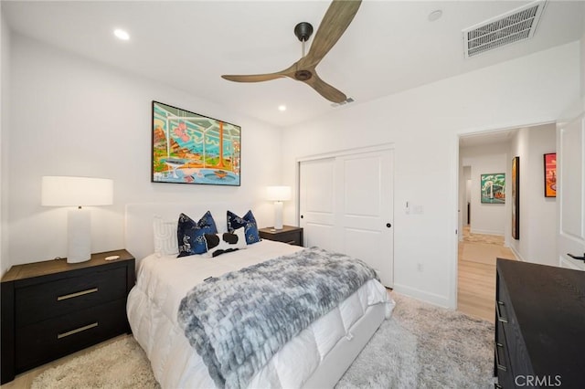 bedroom featuring recessed lighting, a ceiling fan, visible vents, and a closet