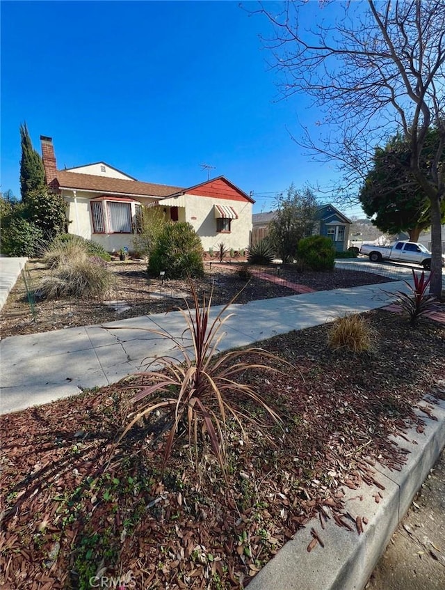 3704 Hellman Ave, Los Angeles, CA 90032 - view of property exterior featuring stucco siding and a chimney
