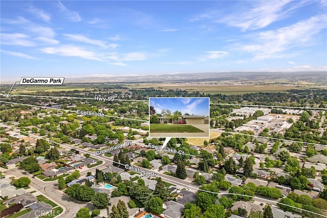 birds eye view of property with a residential view