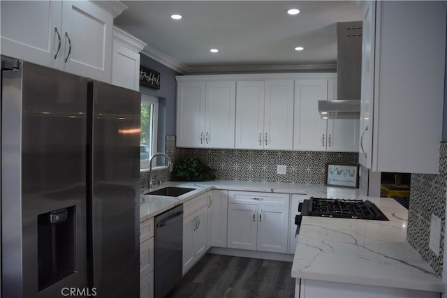 kitchen featuring a sink, crown molding, stainless steel refrigerator with ice dispenser, dishwasher, and island range hood