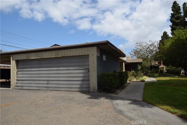 view of side of home featuring a garage