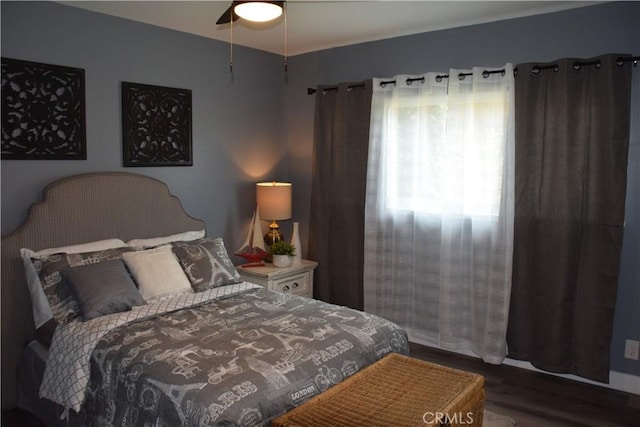 bedroom featuring dark wood-style flooring