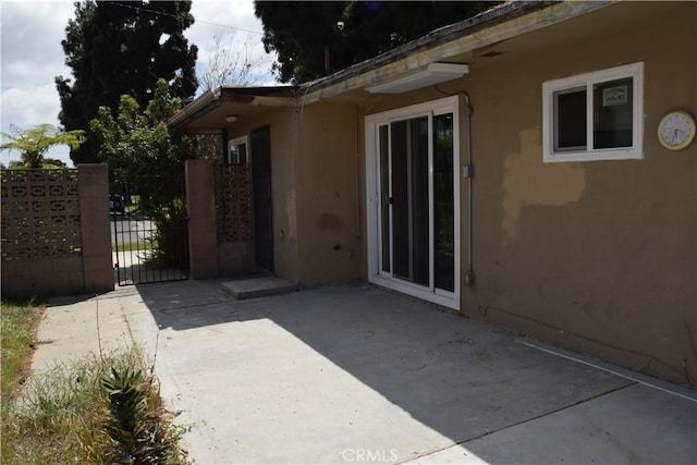 exterior space featuring a gate