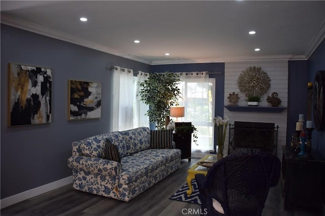 living area with recessed lighting, wood finished floors, ornamental molding, a brick fireplace, and baseboards