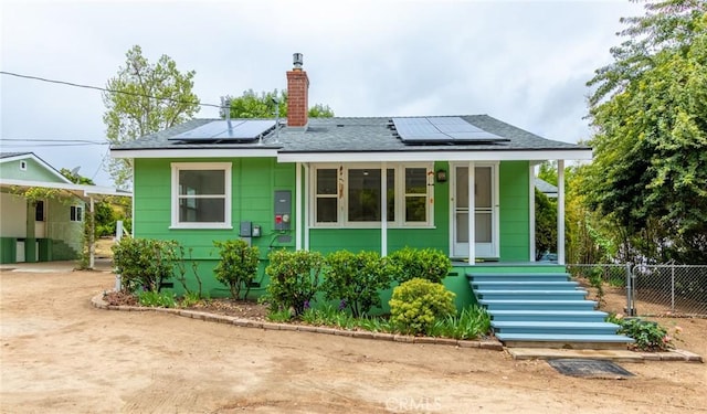 20095 Gustin Rd, Perris, CA 92570 - rear view of property with roof with shingles, fence, a chimney, and solar panels