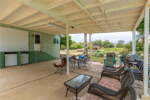 20095 Gustin Rd, Perris, CA 92570 - view of patio with outdoor dining area and washing machine and clothes dryer