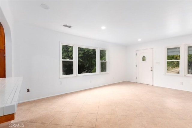20095 Gustin Rd, Perris, CA 92570 - interior space featuring arched walkways, visible vents, a healthy amount of sunlight, and recessed lighting