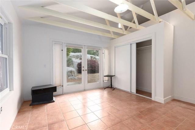 20095 Gustin Rd, Perris, CA 92570 - unfurnished bedroom featuring a closet, light tile patterned flooring, access to exterior, french doors, and lofted ceiling with beams