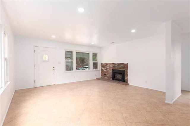 20095 Gustin Rd, Perris, CA 92570 - unfurnished living room featuring recessed lighting, light tile patterned floors, and a fireplace