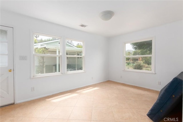20095 Gustin Rd, Perris, CA 92570 - empty room featuring baseboards, visible vents, plenty of natural light, and light tile patterned floors