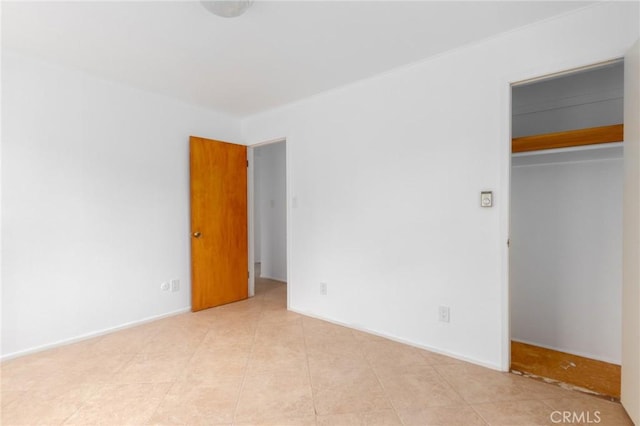 20095 Gustin Rd, Perris, CA 92570 - unfurnished bedroom with light tile patterned floors, a walk in closet, and a closet