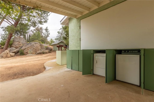 20095 Gustin Rd, Perris, CA 92570 - view of side of home with a patio area, independent washer and dryer, and stucco siding
