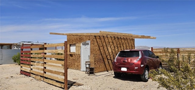 view of outdoor structure with fence