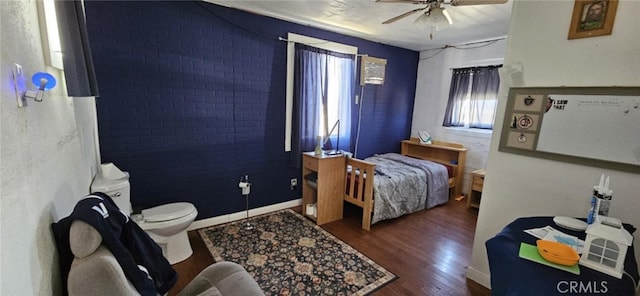 bedroom with a ceiling fan and wood finished floors