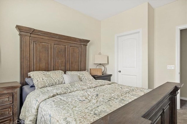 bedroom with carpet and baseboards