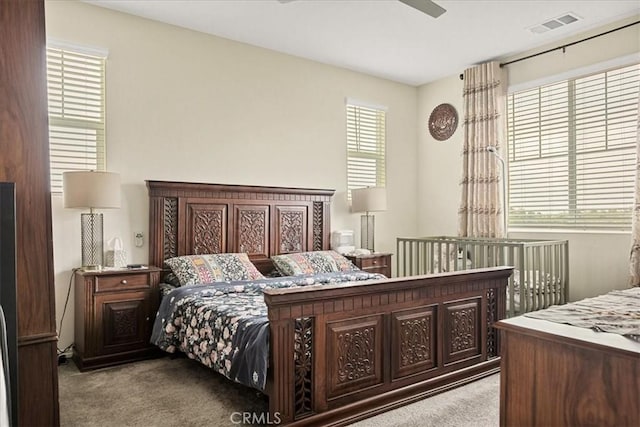 bedroom with carpet flooring and visible vents