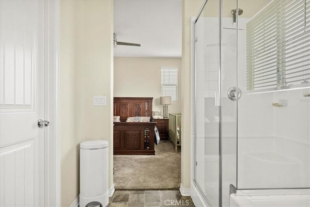 bathroom with a stall shower and connected bathroom