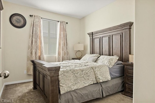 carpeted bedroom with baseboards