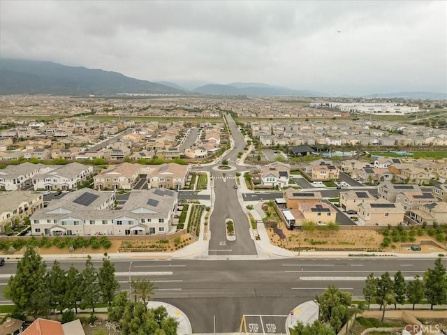 drone / aerial view featuring a mountain view and a residential view