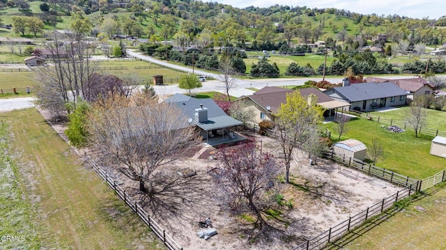 birds eye view of property with a rural view