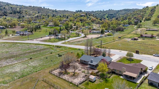aerial view with a mountain view and a rural view