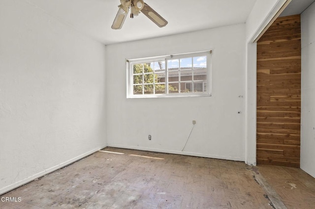 unfurnished room with ceiling fan