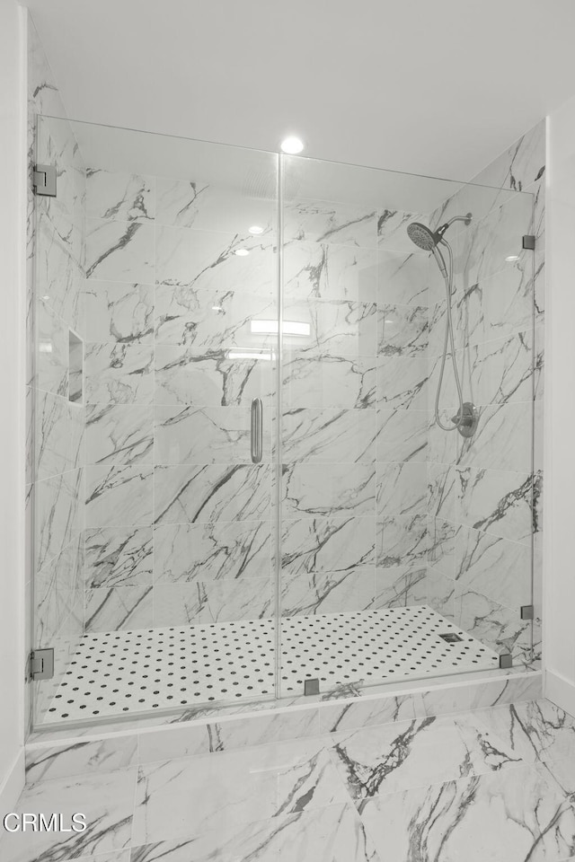 bathroom featuring recessed lighting, a marble finish shower, and marble finish floor