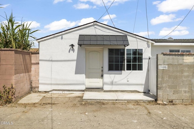 view of outdoor structure with fence