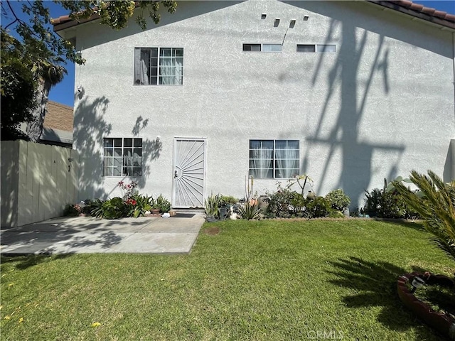 13252 Newland St A-D, Unit A-D Garden Grove, CA 92844 - back of property with a lawn, stucco siding, fence, and a patio