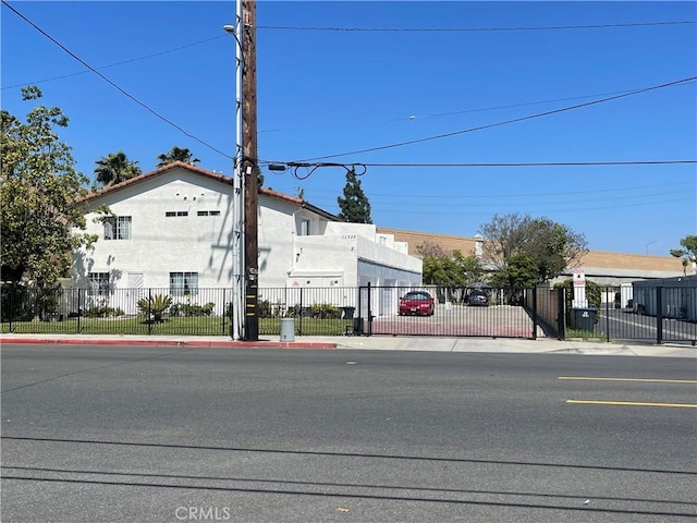 13252 Newland St A-D, Unit A-D Garden Grove, CA 92844 - view of front of property with a gate, fence, and stucco siding