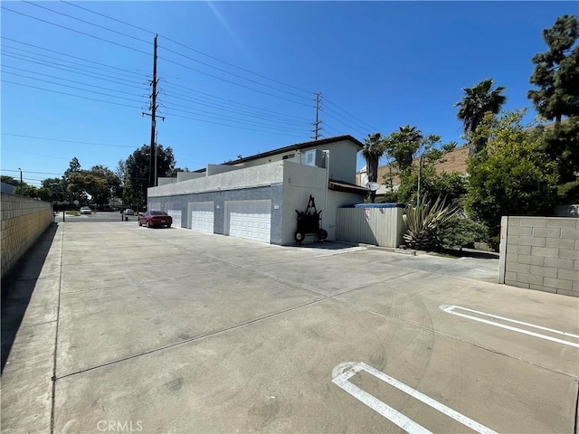 13252 Newland St A-D, Unit A-D Garden Grove, CA 92844 - view of side of property with stucco siding and fence