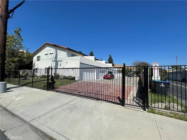 13252 Newland St A-D, Unit A-D Garden Grove, CA 92844 - view of gate featuring fence