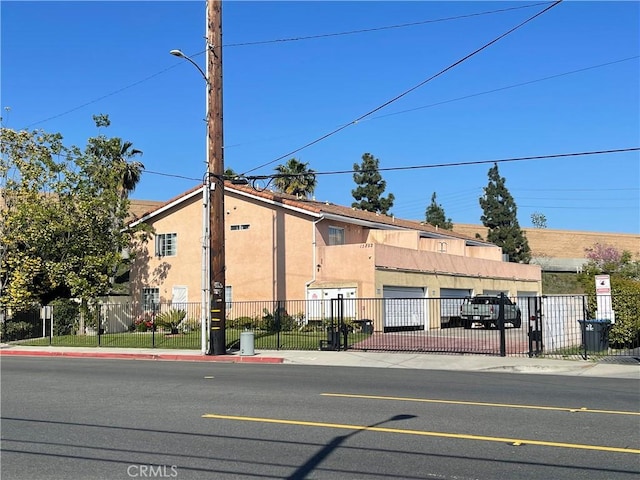 13252 Newland St A-D, Unit A-D Garden Grove, CA 92844 - view of building exterior featuring fence