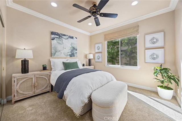 carpeted bedroom featuring crown molding, baseboards, a ceiling fan, and recessed lighting