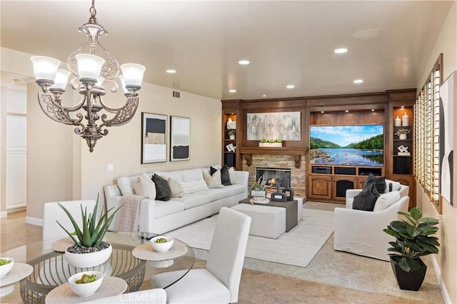 living area with a stone fireplace, visible vents, baseboards, a notable chandelier, and recessed lighting