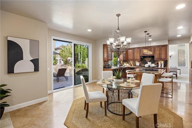 dining space with an inviting chandelier, baseboards, and recessed lighting