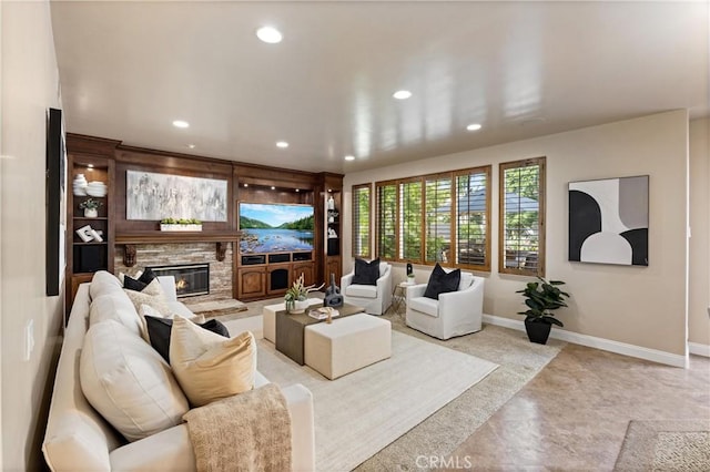 living area featuring recessed lighting, baseboards, and a fireplace