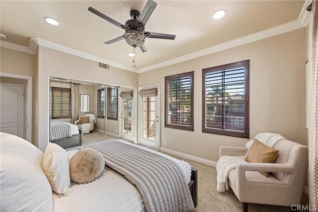carpeted bedroom with visible vents, baseboards, and crown molding