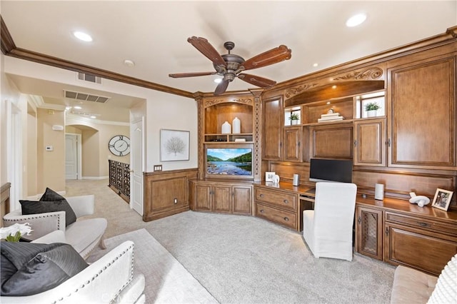 office featuring ceiling fan, built in study area, arched walkways, visible vents, and ornamental molding