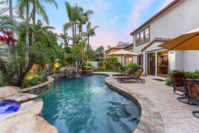 view of pool featuring a fenced in pool, a fenced backyard, and a patio area