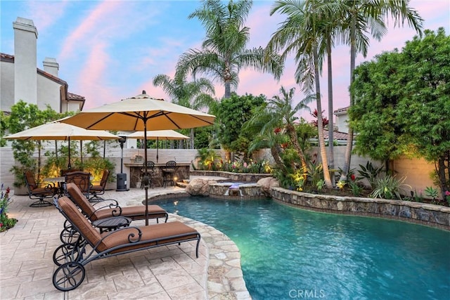 view of swimming pool with a fenced backyard, a fenced in pool, and a patio area