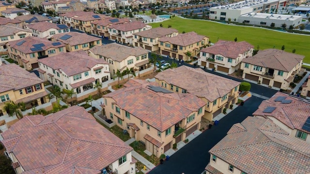 birds eye view of property with a residential view