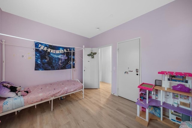 bedroom featuring wood finished floors
