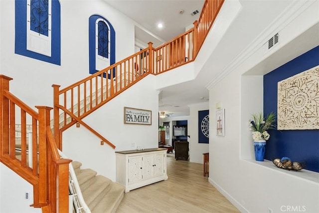 35183 Flamingo Way, Winchester, CA 92596 - staircase featuring wood finished floors, a high ceiling, and a ceiling fan