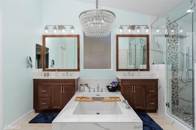 35183 Flamingo Way, Winchester, CA 92596 - bathroom with a shower stall, two vanities, a chandelier, and a garden tub