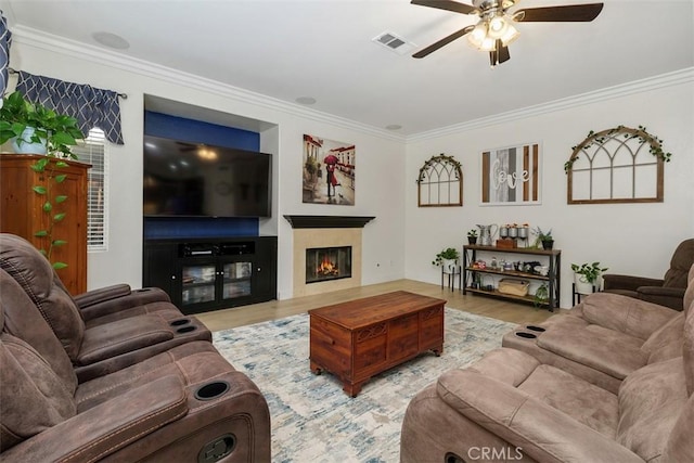 35183 Flamingo Way, Winchester, CA 92596 - living area with a ceiling fan, ornamental molding, wood finished floors, and a warm lit fireplace