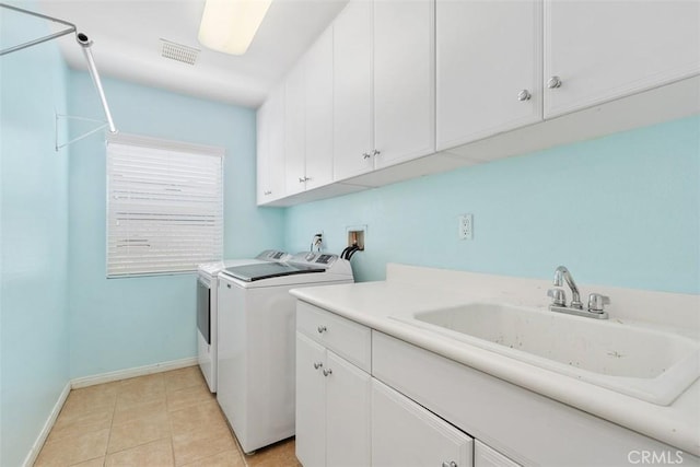 35183 Flamingo Way, Winchester, CA 92596 - washroom featuring cabinet space, washer and dryer, and light tile patterned floors