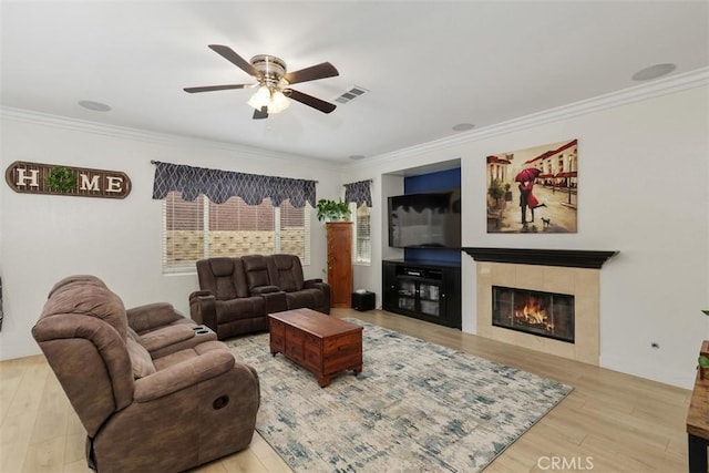 35183 Flamingo Way, Winchester, CA 92596 - living area with ornamental molding, a ceiling fan, wood finished floors, and a tile fireplace